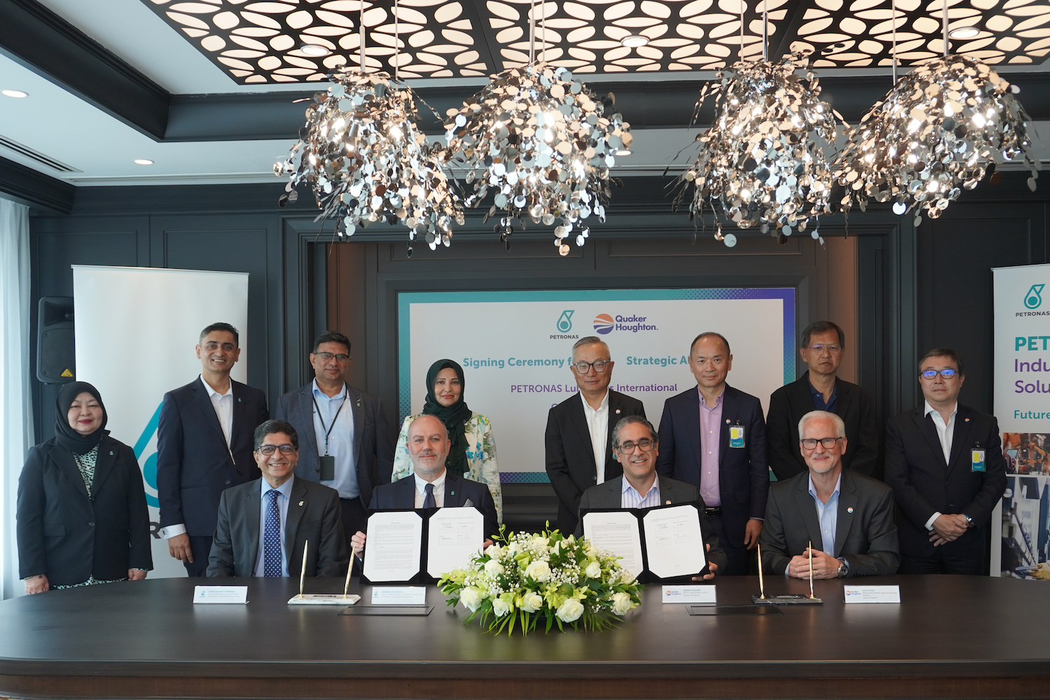 Seated from left: Uday Kumar, Group Industrial Managing Director, PETRONAS Lubricants International; Domenico Ciaglia, Group Chief Strategy and Transformation Officer, PETRONAS Lubricants International; Jeewat Bijlani, Executive Vice President, Global Specialty and Chief Growth Officer, Quaker Houghton; and Karl Kunkel, Global Vice President, Metals & Operating Solutions, Quaker Houghton, along with representatives from both companies.