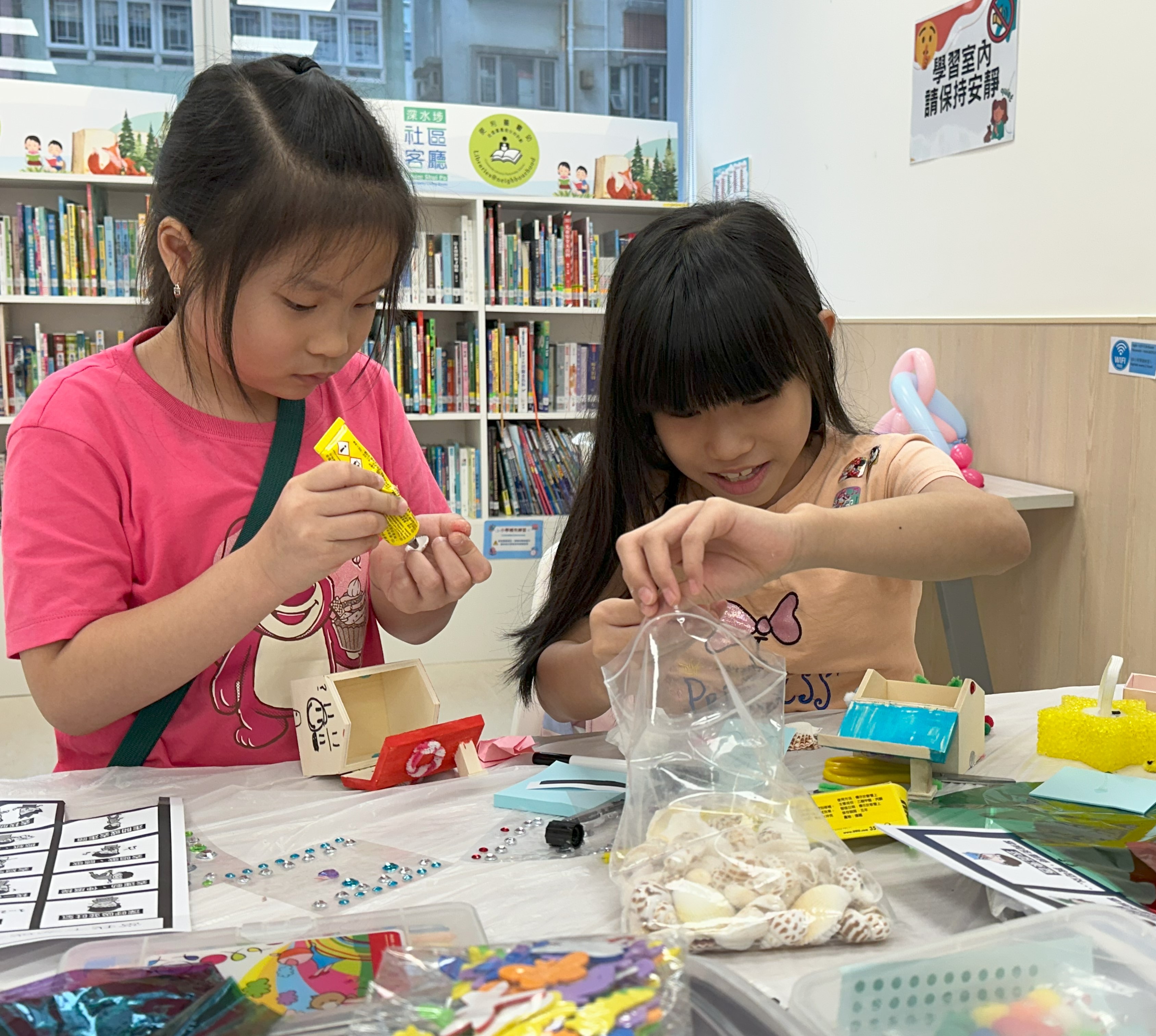 8-year-old Cara* (right) expresses her feelings through artistic creation